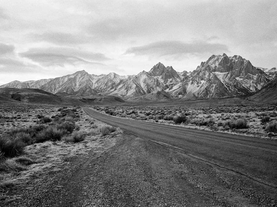 A road leading to snow-capped mountains near Queenstown.